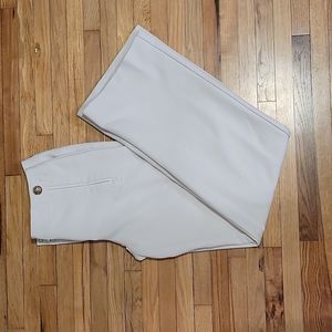 White fitted high-waisted dress pants with gold buttons